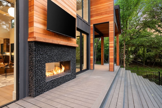 deck with a tile fireplace