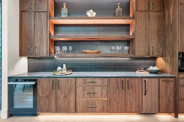 bar with indoor bar, beverage cooler, and decorative backsplash