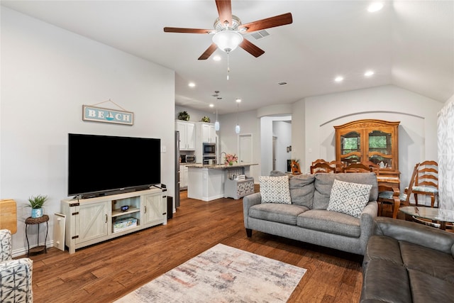 living area featuring visible vents, a ceiling fan, dark wood-style flooring, and recessed lighting