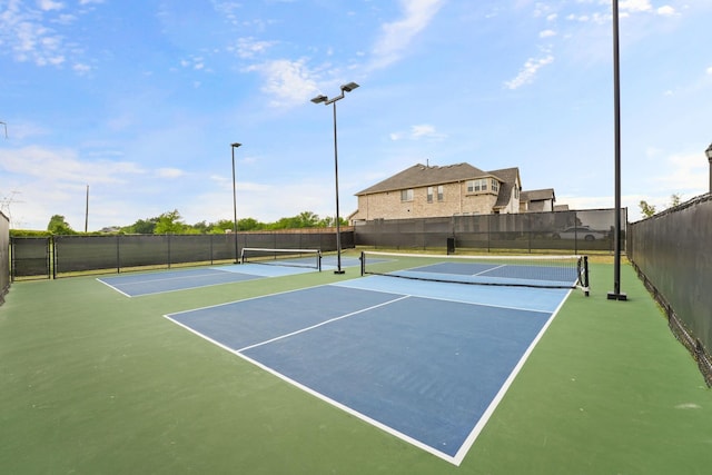 view of sport court with fence