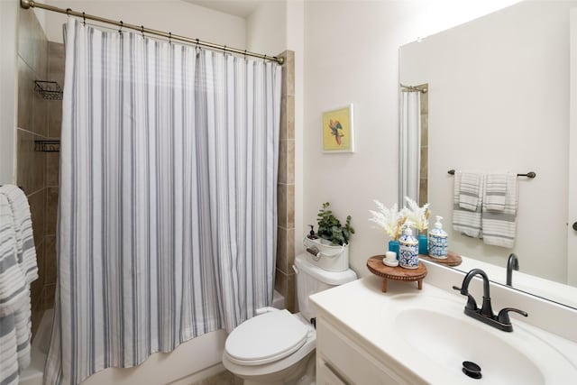 full bath with vanity, toilet, and shower / tub combo