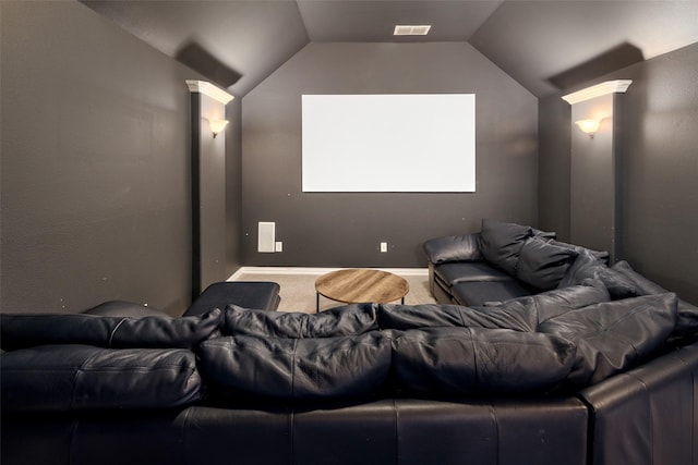 cinema featuring carpet floors, vaulted ceiling, and visible vents