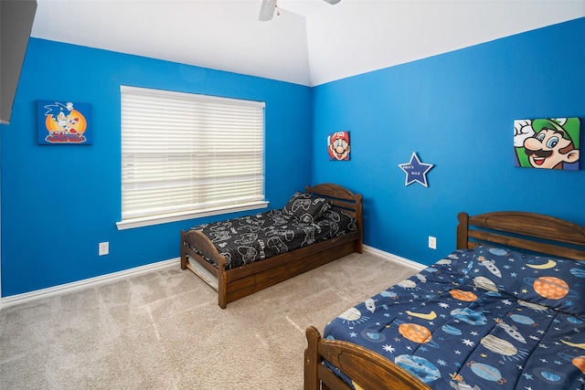 carpeted bedroom with a ceiling fan, baseboards, and lofted ceiling