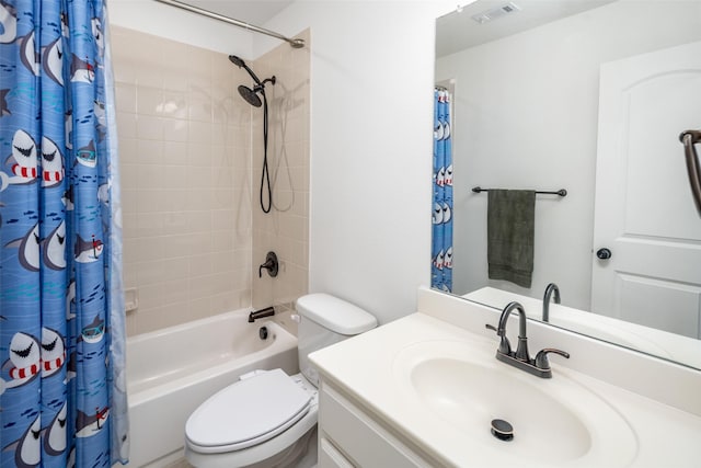 bathroom featuring vanity, toilet, visible vents, and shower / bath combo with shower curtain