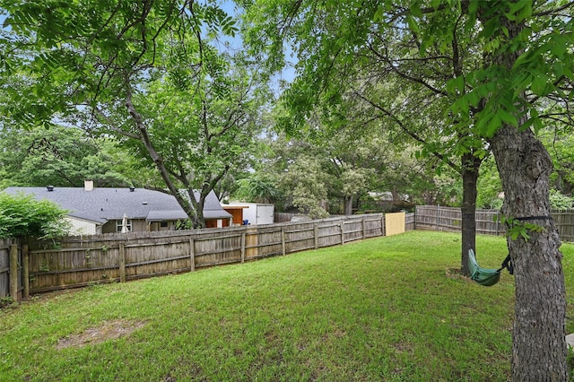 view of yard featuring a fenced backyard