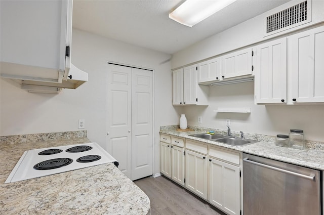kitchen featuring range with electric cooktop, visible vents, dishwasher, light countertops, and light wood-style flooring