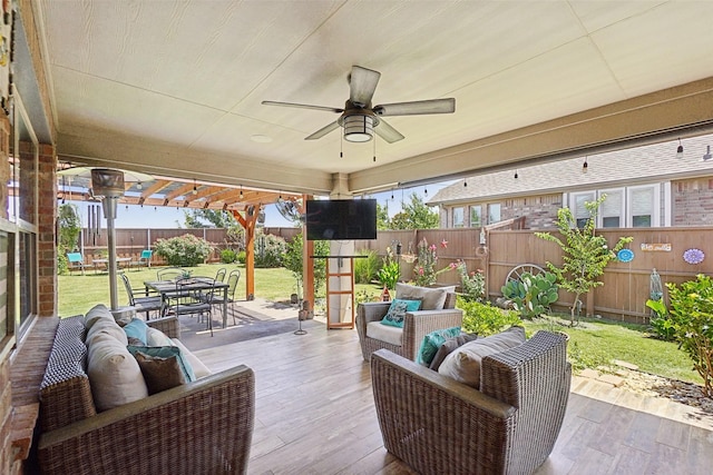 view of patio / terrace with a fenced backyard, a ceiling fan, outdoor dining space, and an outdoor hangout area