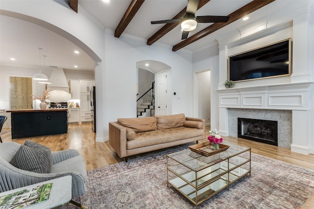 kitchen with crown molding, white cabinets, wood counters, visible vents, and black appliances