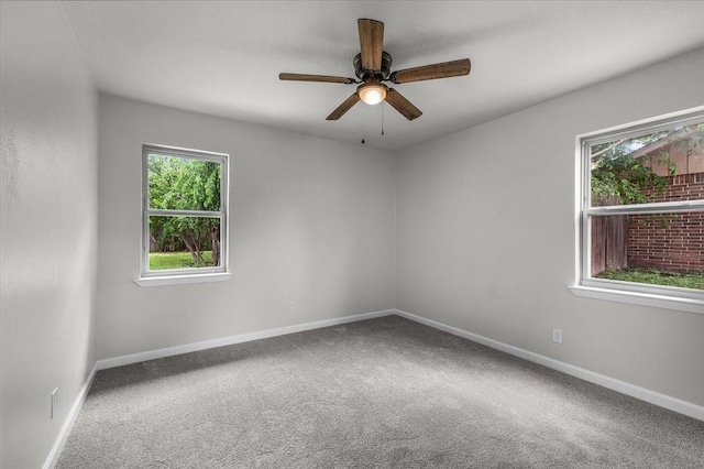 1013 Springdale Rd, Bedford, TX 76021 - carpeted spare room featuring baseboards, a ceiling fan, and a wealth of natural light