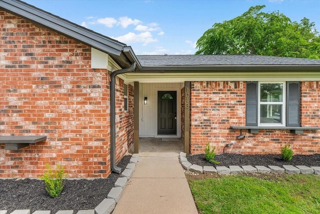 1013 Springdale Rd, Bedford, TX 76021 - view of exterior entry featuring brick siding