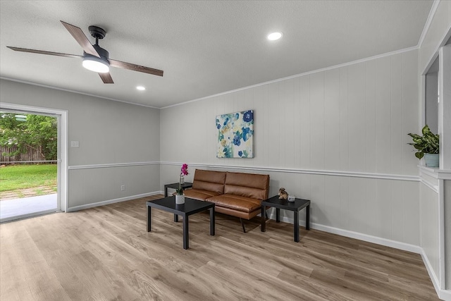 1013 Springdale Rd, Bedford, TX 76021 - sitting room featuring a ceiling fan, a textured ceiling, wood finished floors, and ornamental molding