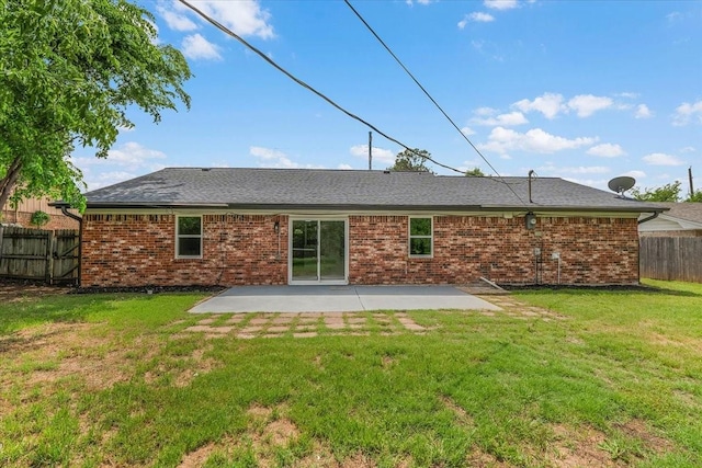 1013 Springdale Rd, Bedford, TX 76021 - back of house featuring a lawn, a patio area, brick siding, fence, and a shingled roof