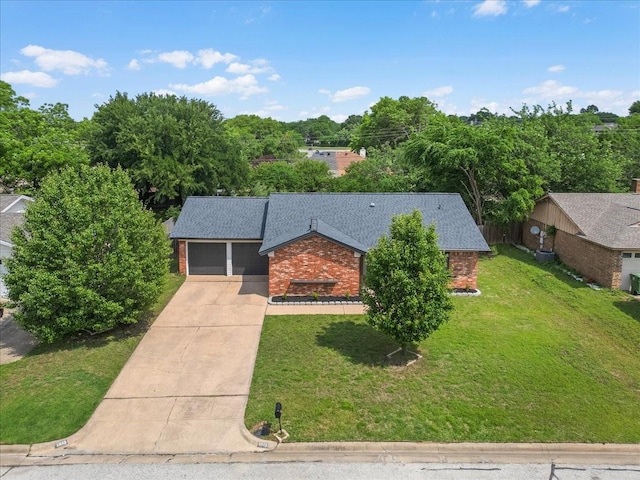 1013 Springdale Rd, Bedford, TX 76021 - view of front of house featuring an attached garage, a front yard, driveway, and brick siding