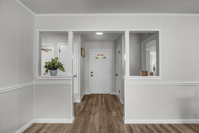 1013 Springdale Rd, Bedford, TX 76021 - foyer with baseboards, ornamental molding, and wood finished floors