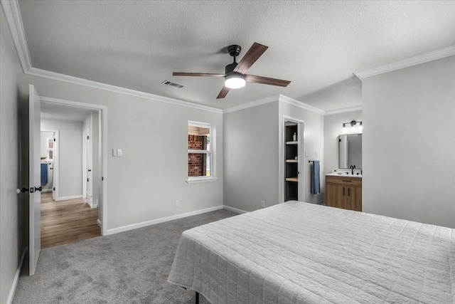 1013 Springdale Rd, Bedford, TX 76021 - bedroom with visible vents, ornamental molding, carpet, and a textured ceiling