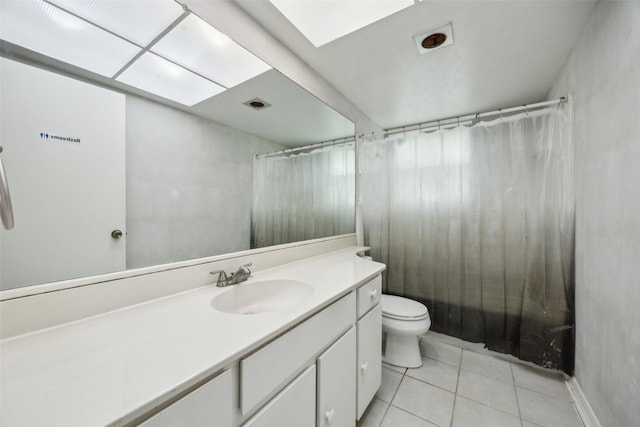 full bathroom with tile patterned flooring, toilet, and vanity