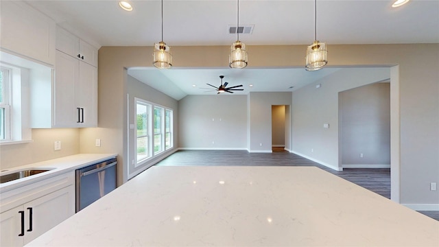 kitchen with dishwasher, white cabinetry, wood finished floors, visible vents, and pendant lighting