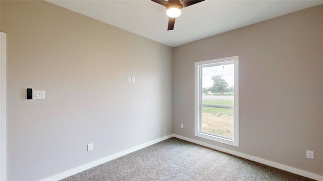 unfurnished room with carpet flooring, baseboards, and ceiling fan