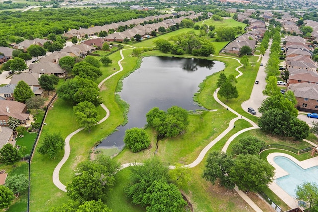 bird's eye view featuring a water view and a residential view