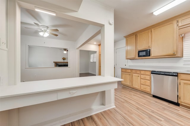 kitchen with ceiling fan, black microwave, light brown cabinetry, dishwasher, and light countertops