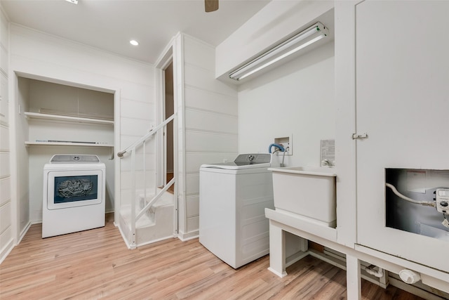 washroom with separate washer and dryer, laundry area, recessed lighting, and light wood-type flooring