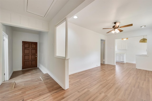 entrance foyer featuring baseboards, a ceiling fan, light wood finished floors, and recessed lighting