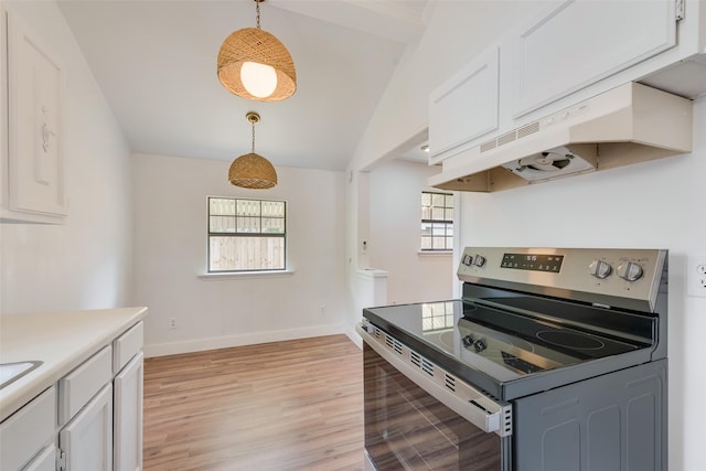 kitchen featuring light wood-type flooring, light countertops, stainless steel electric range, white cabinets, and decorative light fixtures