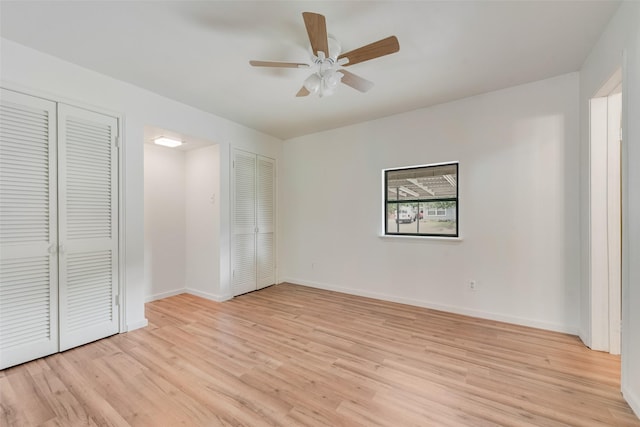 unfurnished bedroom featuring baseboards, ceiling fan, and light wood-style flooring