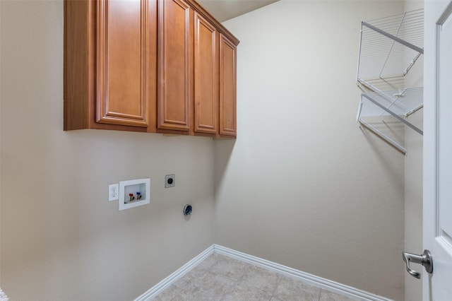 laundry room with washer hookup, hookup for an electric dryer, baseboards, and cabinet space