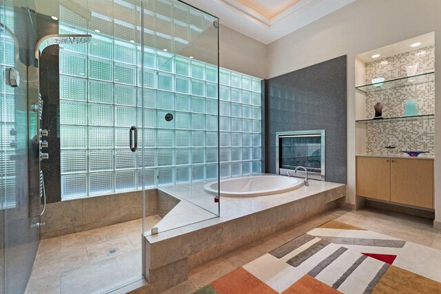 11715 Parwen Dr, Dallas, TX 75230 - full bath with a bath, a stall shower, built in shelves, vanity, and recessed lighting