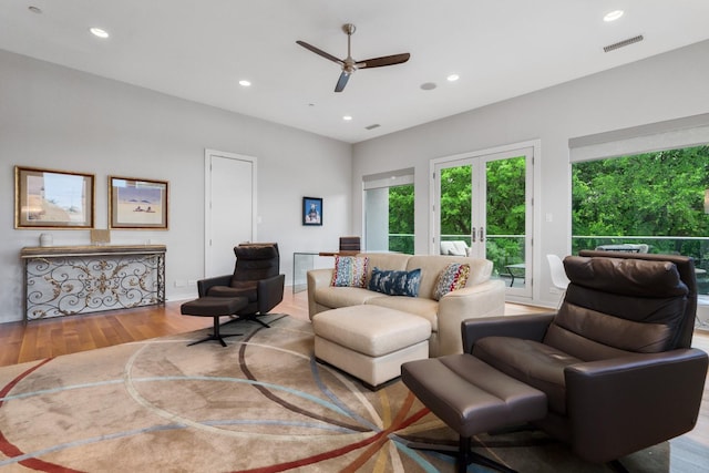 11715 Parwen Dr, Dallas, TX 75230 - living room featuring a ceiling fan, visible vents, wood finished floors, and recessed lighting
