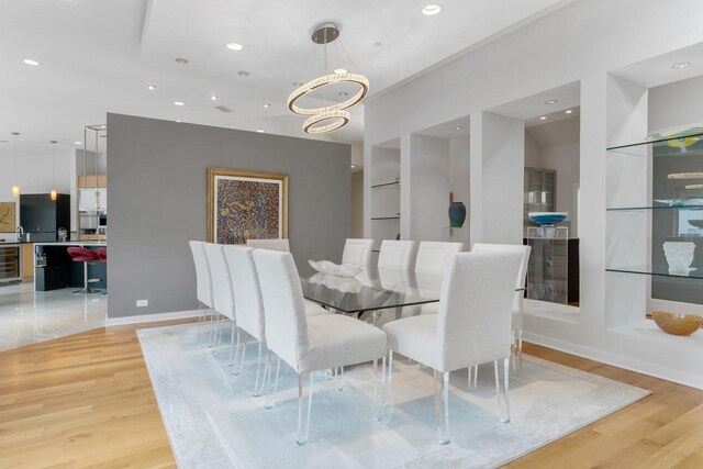11715 Parwen Dr, Dallas, TX 75230 - dining space featuring recessed lighting, built in features, and light wood finished floors