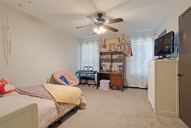 carpeted bedroom with a ceiling fan