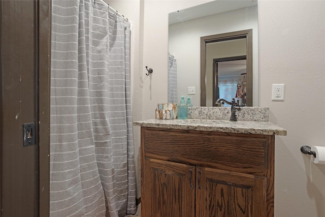 bathroom with vanity and curtained shower