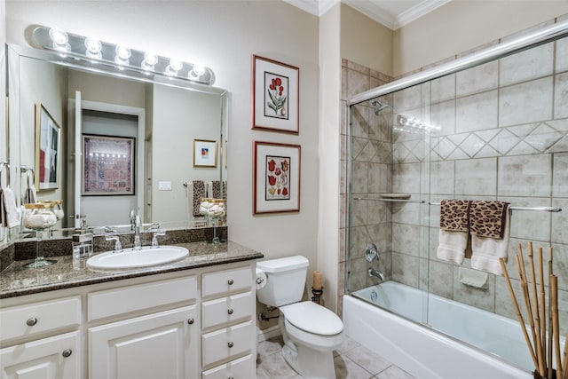 bathroom featuring vanity, tile patterned floors, toilet, shower / bath combination with glass door, and ornamental molding