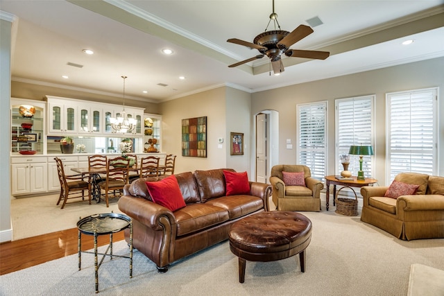 living area with crown molding, recessed lighting, and wood finished floors