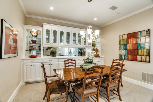 dining area with crown molding, baseboards, visible vents, and light carpet