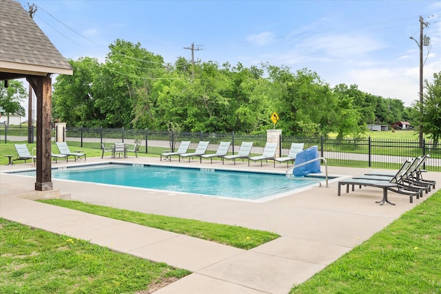 2114 Burke Dr, Princeton, TX 75407 - community pool with a lawn, a patio area, and fence