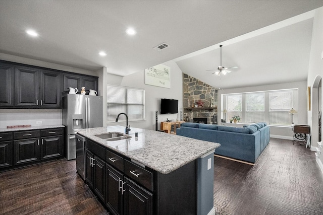 2114 Burke Dr, Princeton, TX 75407 - kitchen with dark cabinets, ceiling fan, a sink, and dark wood-type flooring