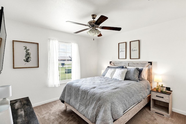 carpeted bedroom featuring a ceiling fan and baseboards