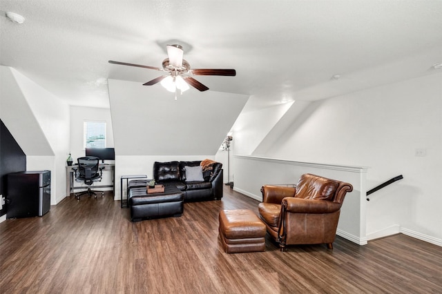interior space featuring baseboards, ceiling fan, an upstairs landing, and wood finished floors
