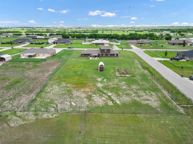 birds eye view of property with a residential view