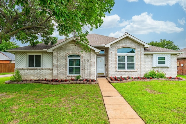 7129 Dee Cole Dr, The Colony, TX 75056 - ranch-style home featuring brick siding, a front lawn, and roof with shingles