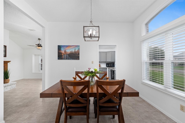 7129 Dee Cole Dr, The Colony, TX 75056 - dining space with a chandelier, light tile patterned floors, and a ceiling fan