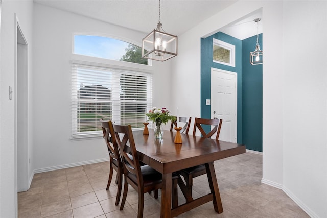 7129 Dee Cole Dr, The Colony, TX 75056 - dining space featuring a chandelier, healthy amount of natural light, and light tile patterned floors