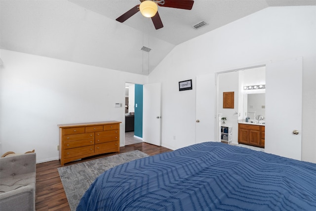 7129 Dee Cole Dr, The Colony, TX 75056 - bedroom featuring dark wood-style flooring, ensuite bath, a ceiling fan, and high vaulted ceiling