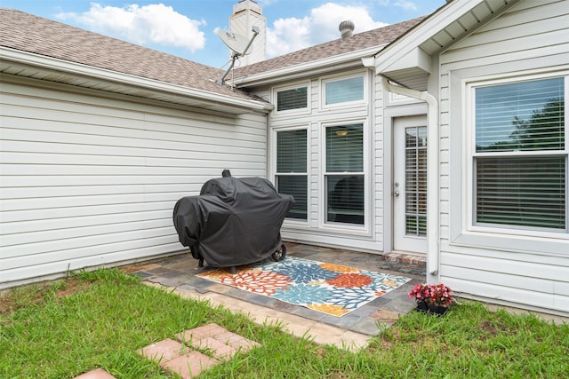 view of patio featuring a grill