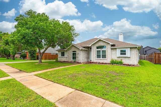 7129 Dee Cole Dr, The Colony, TX 75056 - ranch-style home with a chimney, brick siding, and a shingled roof