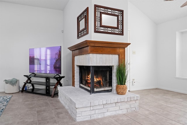 7129 Dee Cole Dr, The Colony, TX 75056 - unfurnished living room with tile patterned floors, vaulted ceiling, a brick fireplace, and ceiling fan