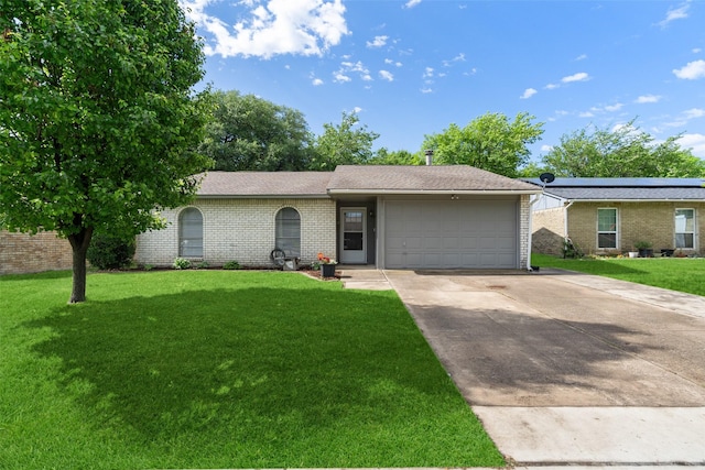 ranch-style home with an attached garage, a front lawn, driveway, and brick siding